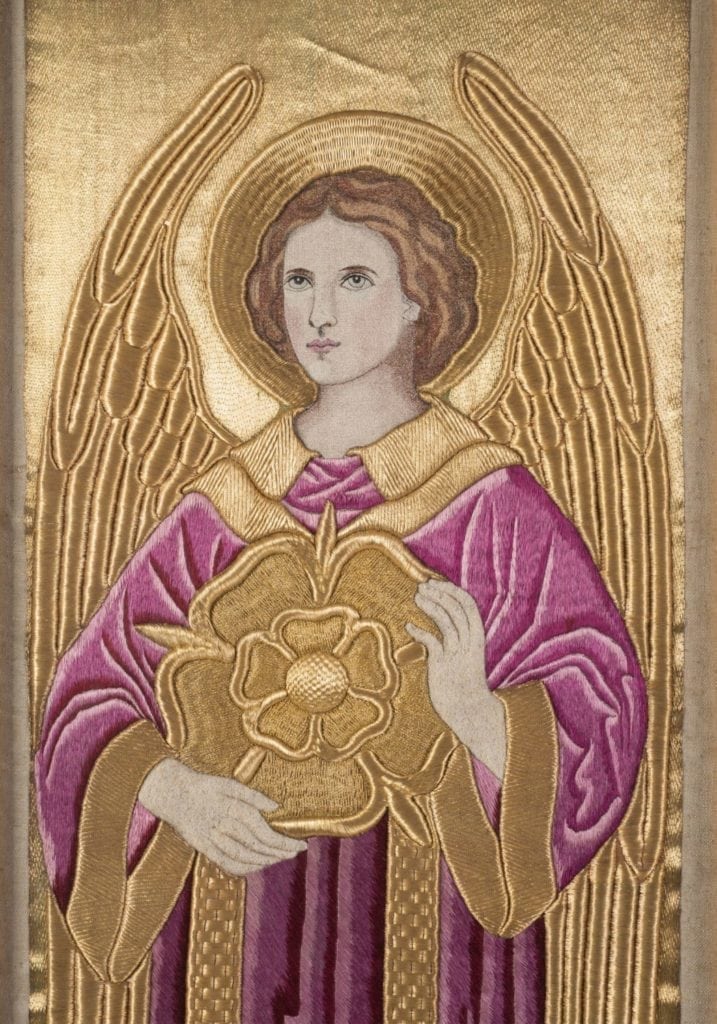Restoration work on antique religous ambroideries
